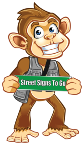 company mascot "Togo" with Street Sign